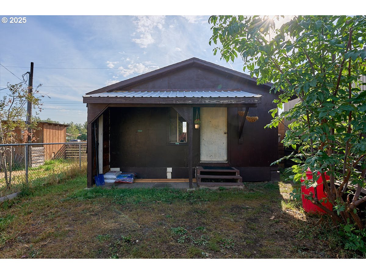 402 South East Street Joseph, OR 97846 - Photo 16 of 22 a front view of a house with garden