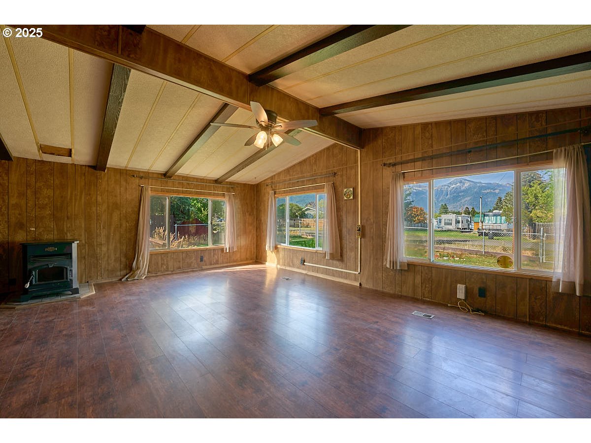 402 South East Street Joseph, OR 97846 - Photo 3 of 22 a view of an empty room with a window and wooden floor