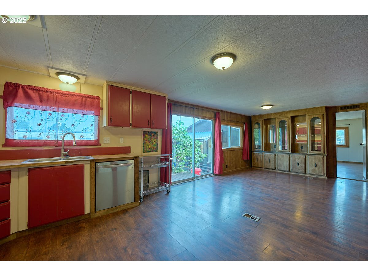 402 South East Street Joseph, OR 97846 - Photo 7 of 22 a kitchen with stainless steel appliances granite countertop a stove a sink and a large window