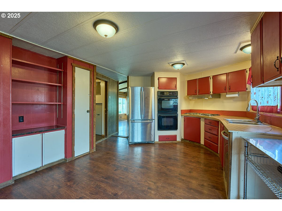 402 South East Street Joseph, OR 97846 - Photo 8 of 22 a open kitchen with stainless steel appliances granite countertop a refrigerator and a stove top oven