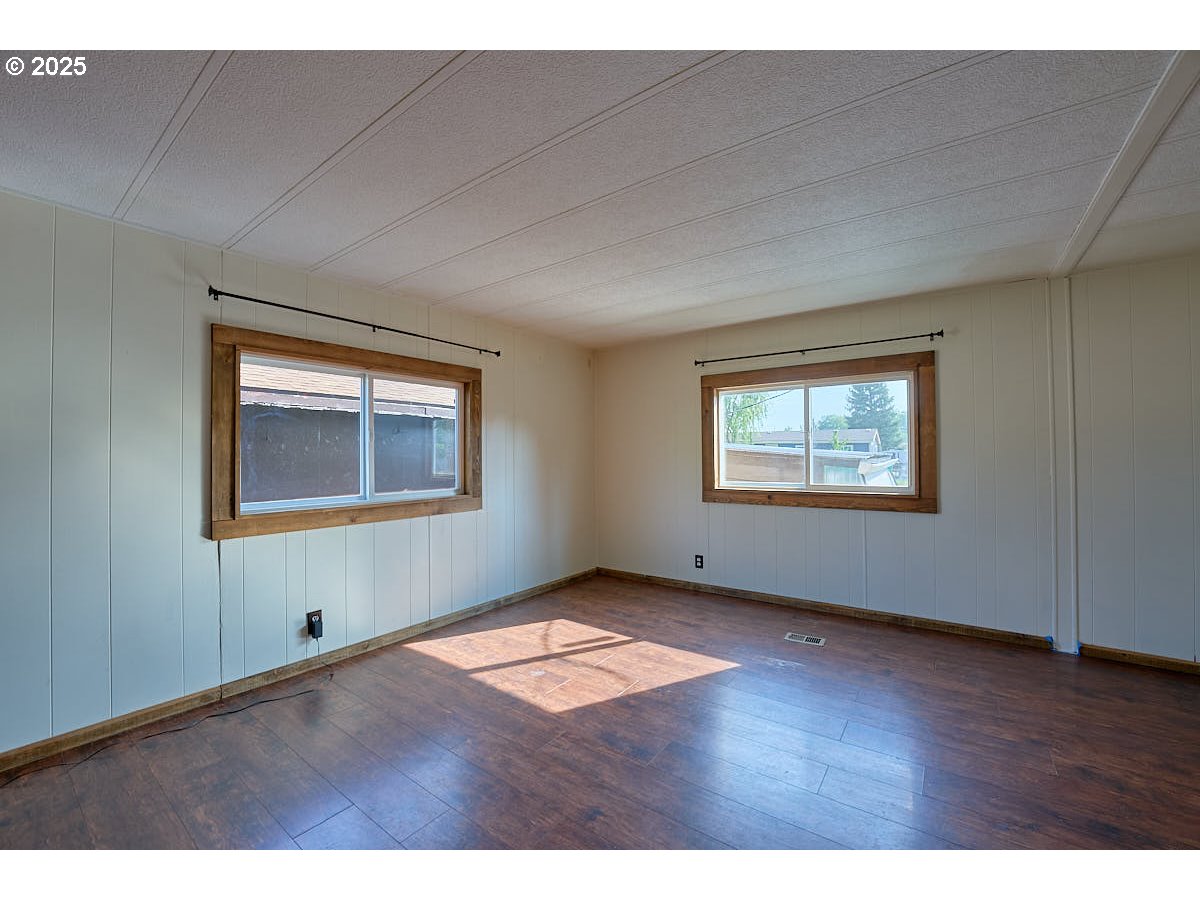 402 South East Street Joseph, OR 97846 - Photo 9 of 22 a view of an empty room with a window and wooden floor