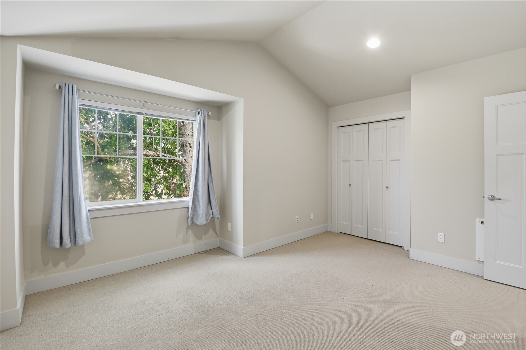 723 North 95th Street, Unit A Seattle, WA 98103 - Photo 13 of 20 an empty room with windows