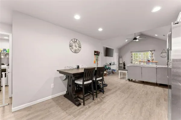 a view of a dining room with furniture and window