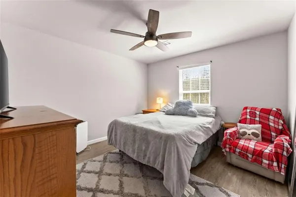 a bedroom with a bed and a dresser