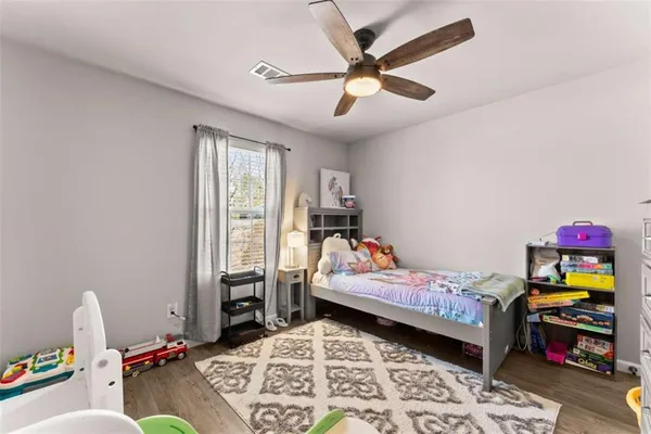 a bedroom with bed and furniture