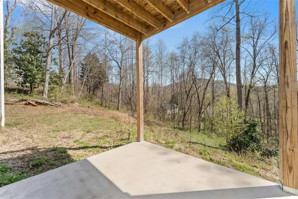 a backyard of a house with lots of green space
