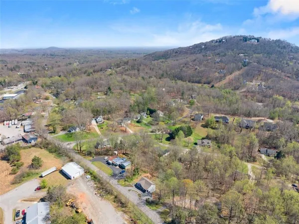 a view of a house with a yard covered with snow in the background