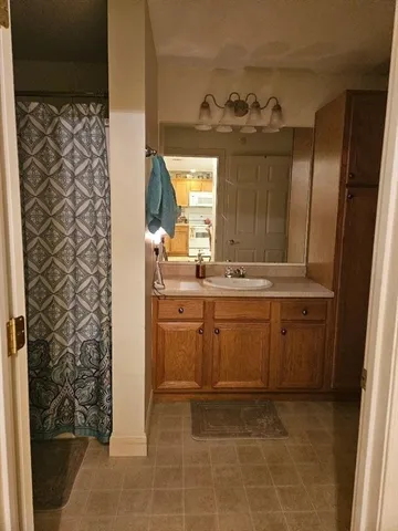 a room with a sink and cabinets