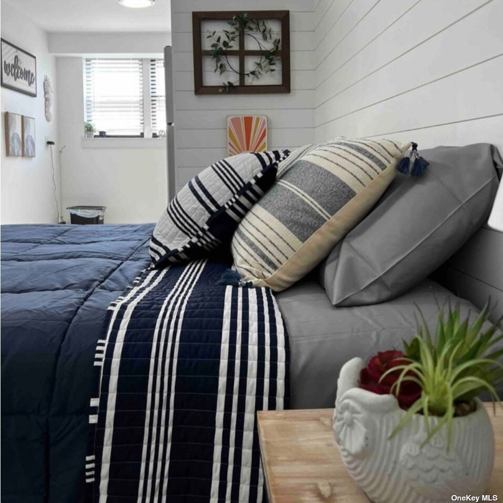 65 Long Beach, undefined 00000 - Photo 2 of 10 a bedroom with a bed and a couch