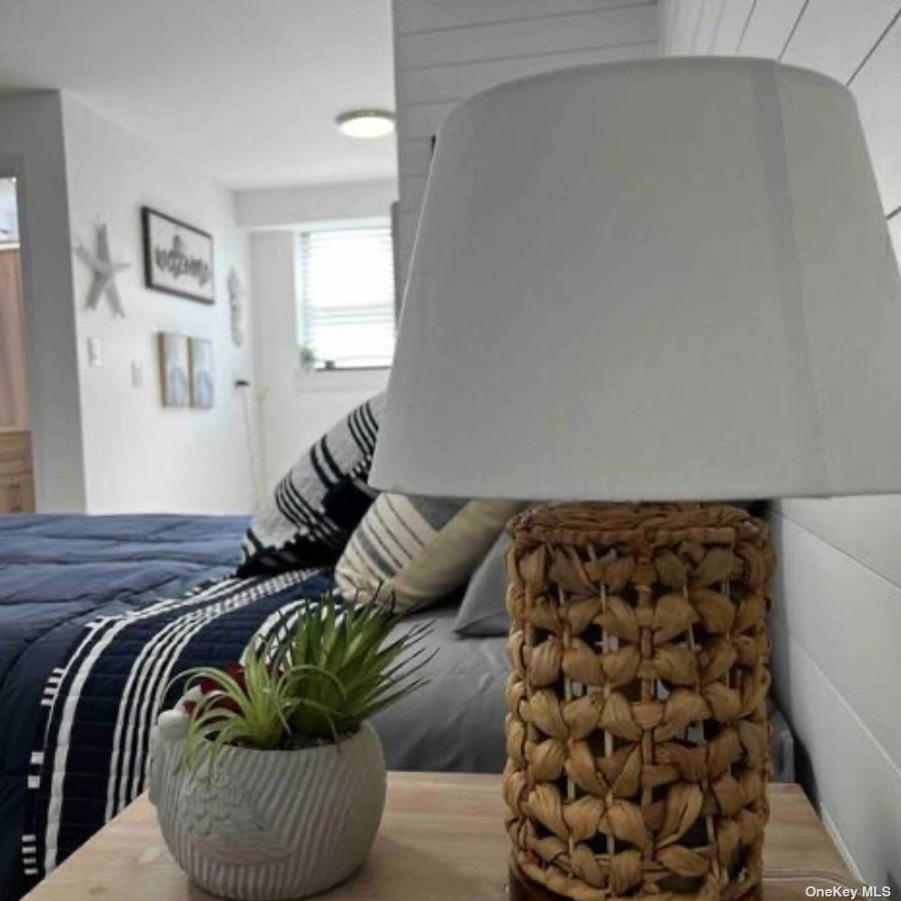 65 Long Beach, undefined 00000 - Photo 4 of 10 a bedroom with a bed and a couch