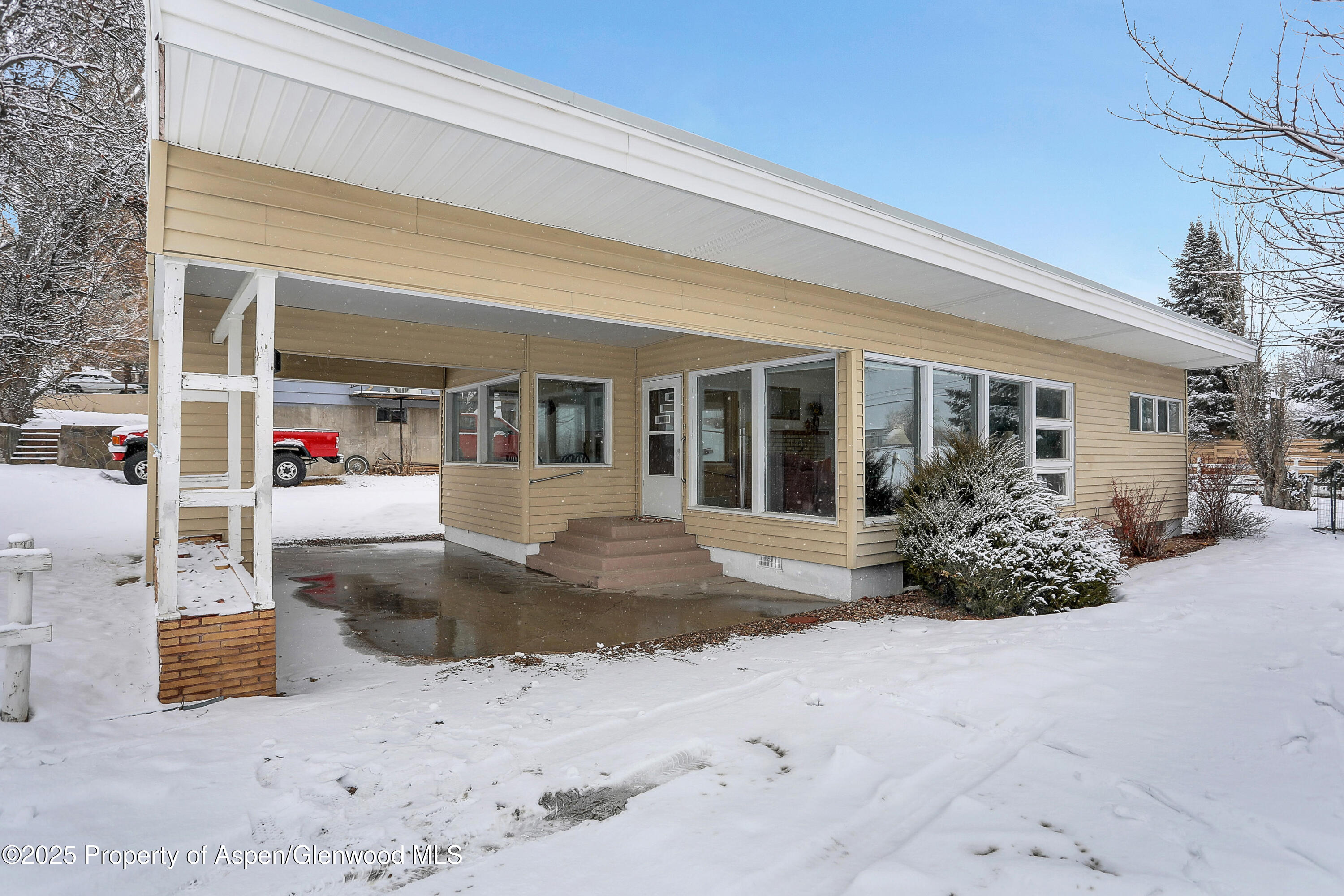 a view of a house with outdoor seating