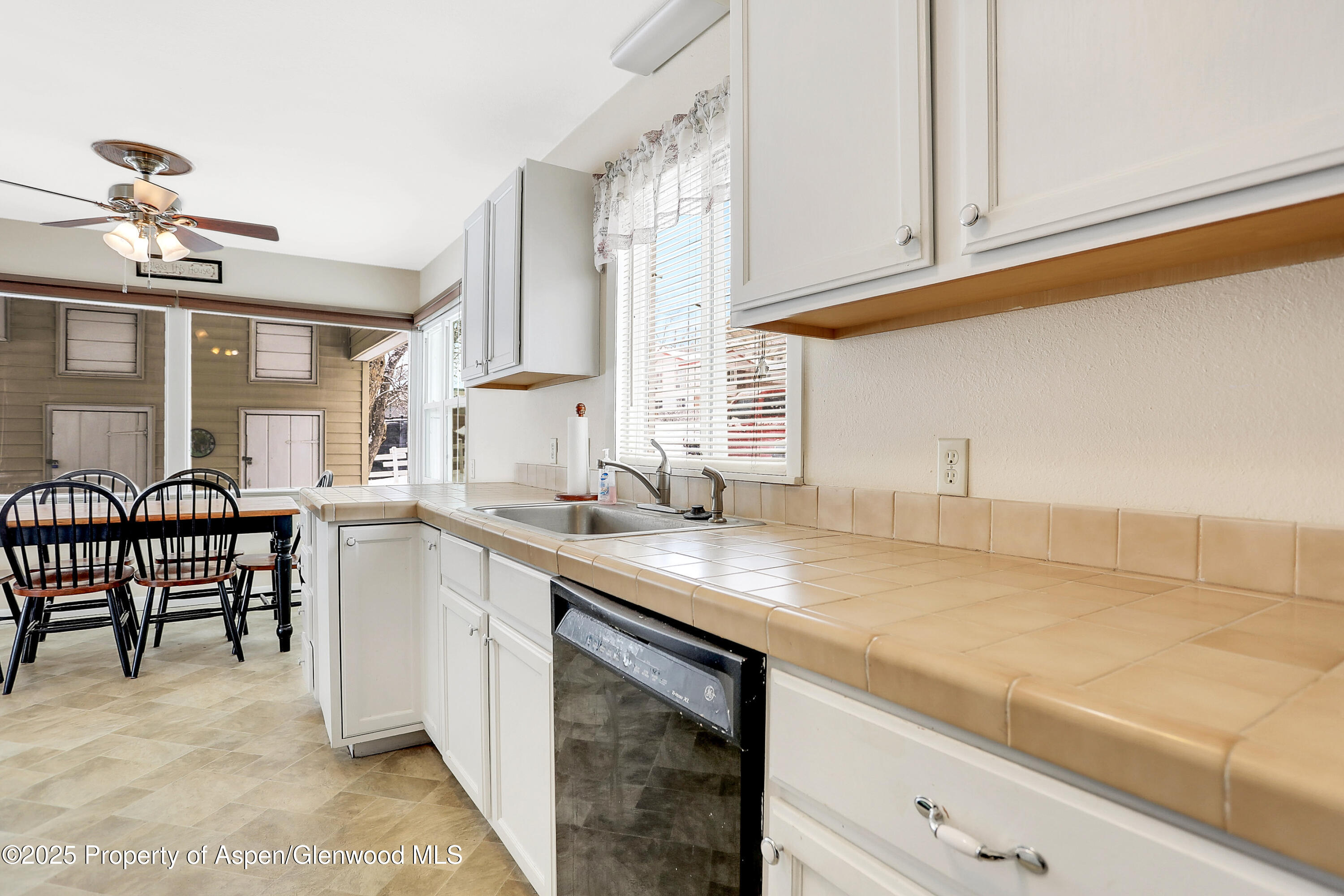 901 Pershing Street Craig, CO 81625 - Photo 12 of 37 a kitchen with a sink cabinets and window