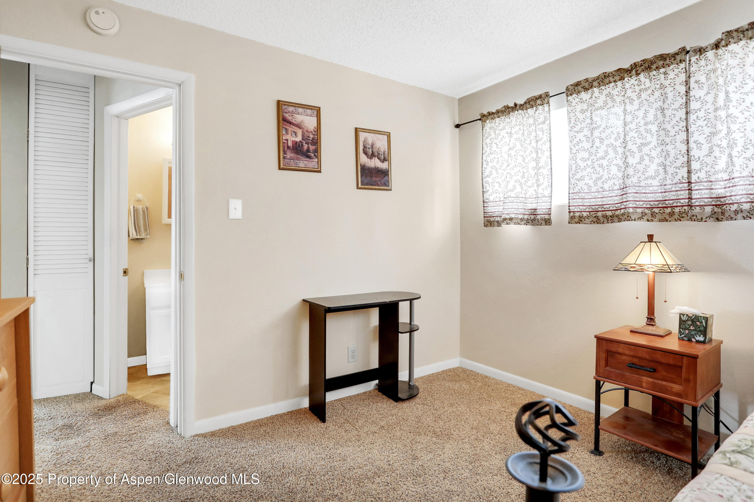 901 Pershing Street Craig, CO 81625 - Photo 15 of 37 a room with window and a table