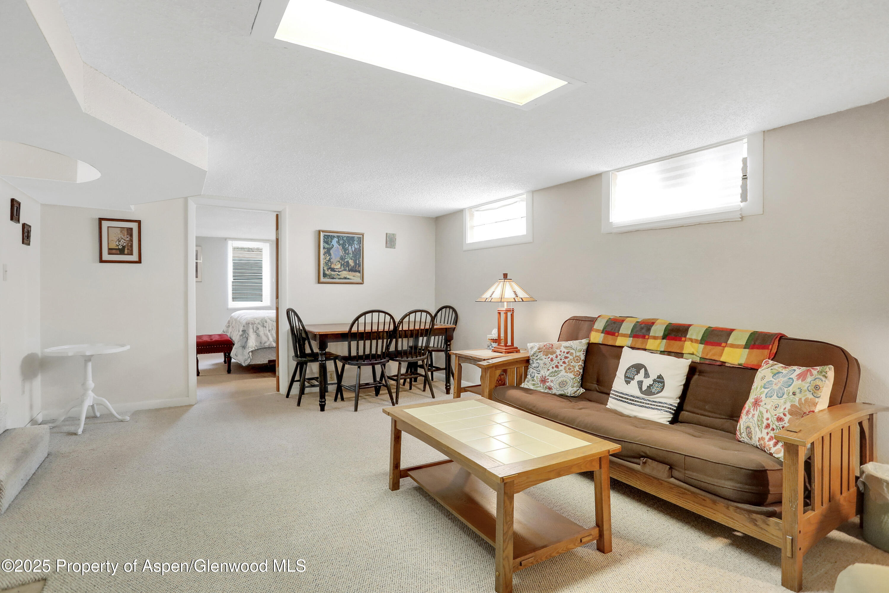901 Pershing Street Craig, CO 81625 - Photo 22 of 37 a living room with furniture and a table
