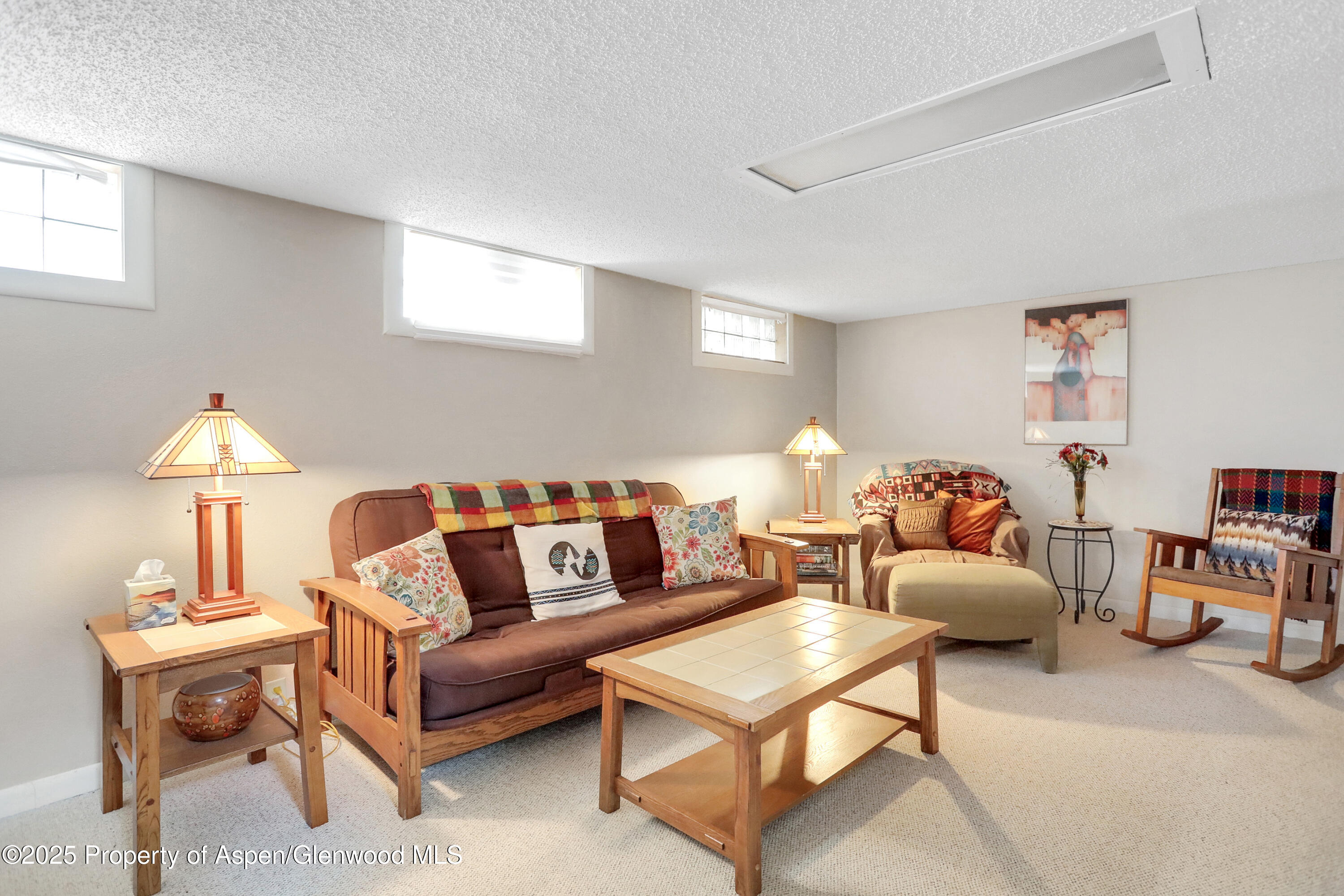 901 Pershing Street Craig, CO 81625 - Photo 24 of 37 a living room with furniture and a lamp