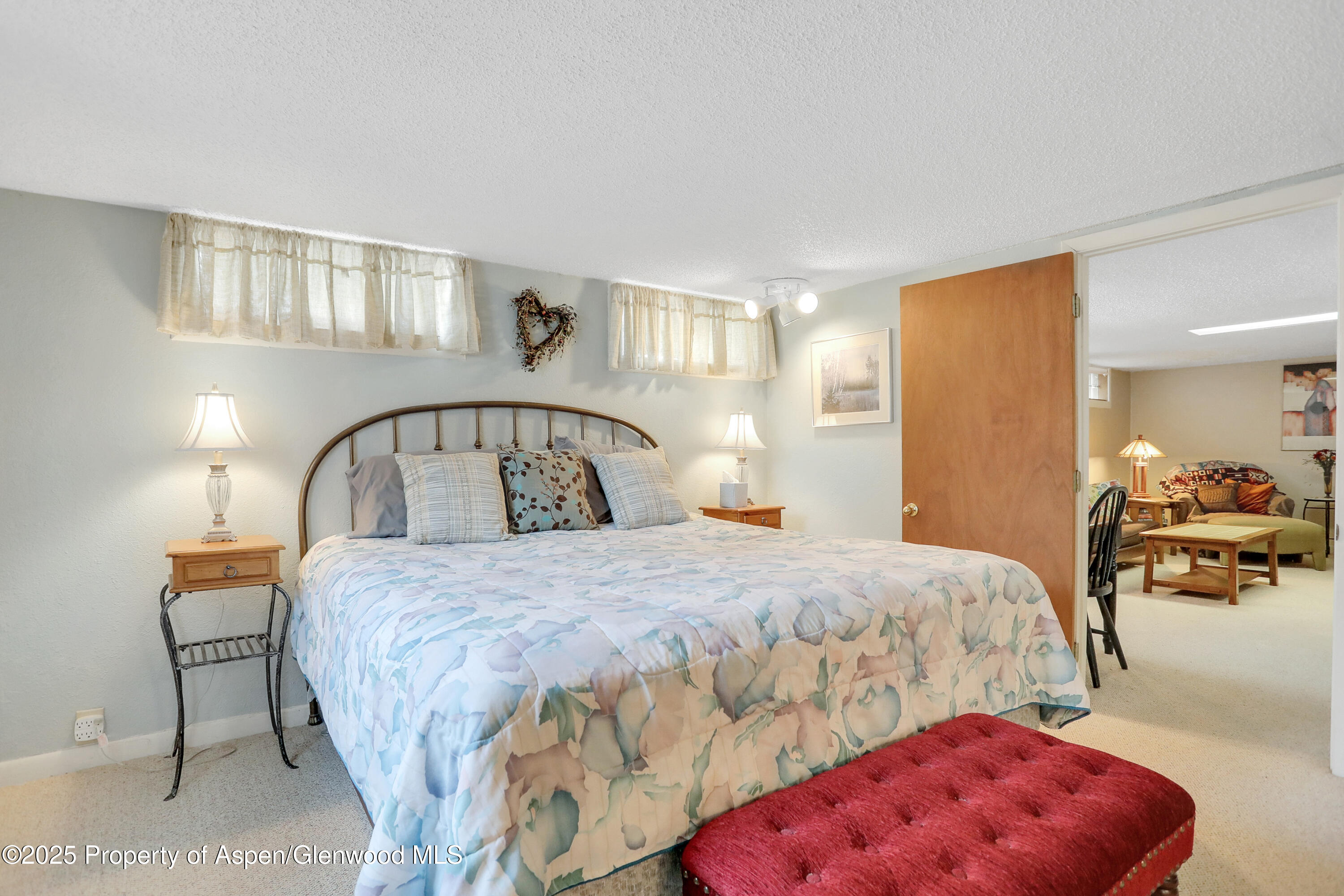 901 Pershing Street Craig, CO 81625 - Photo 25 of 37 a bedroom with a bed and a mirror