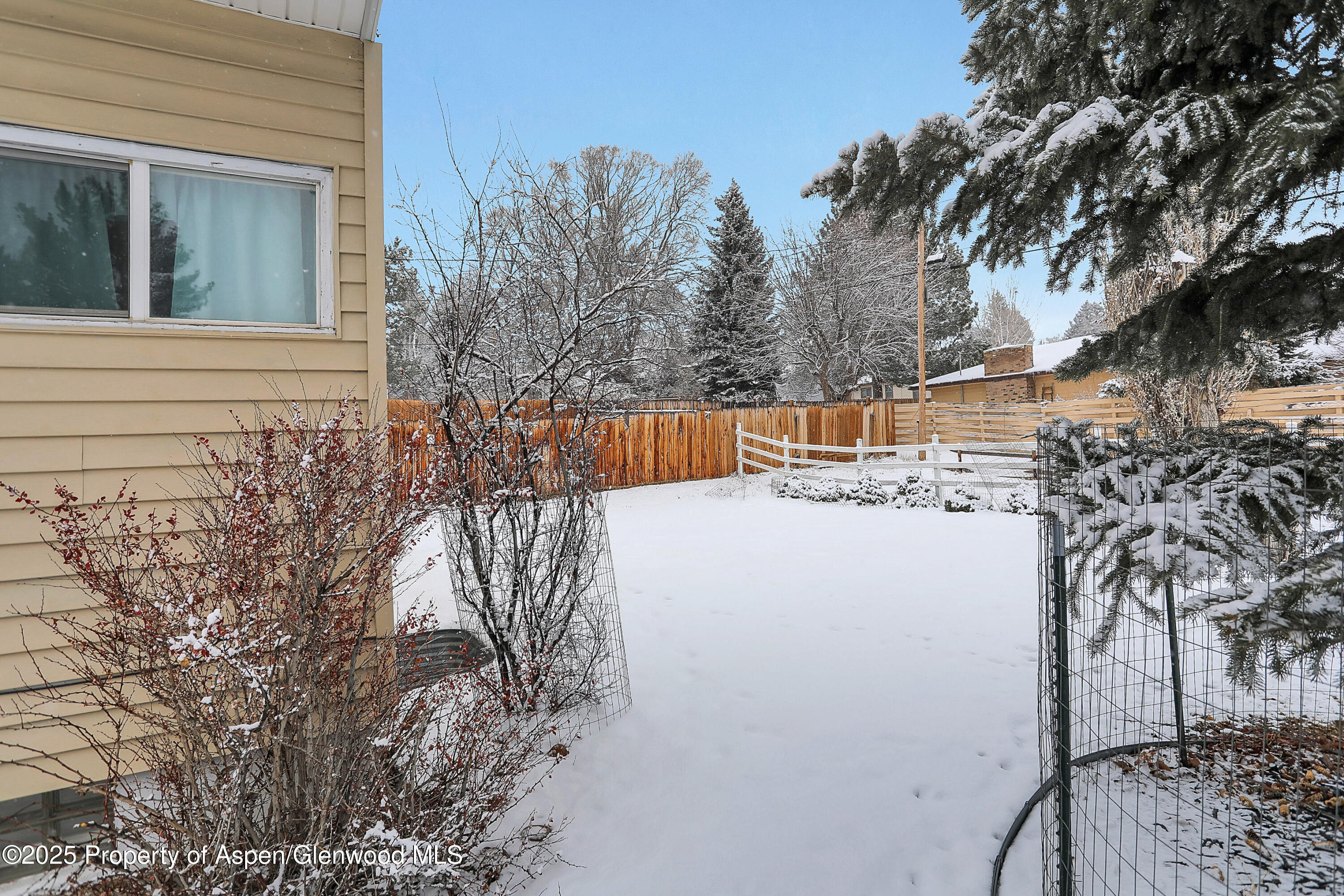 901 Pershing Street Craig, CO 81625 - Photo 31 of 37 a view of a house with a snow