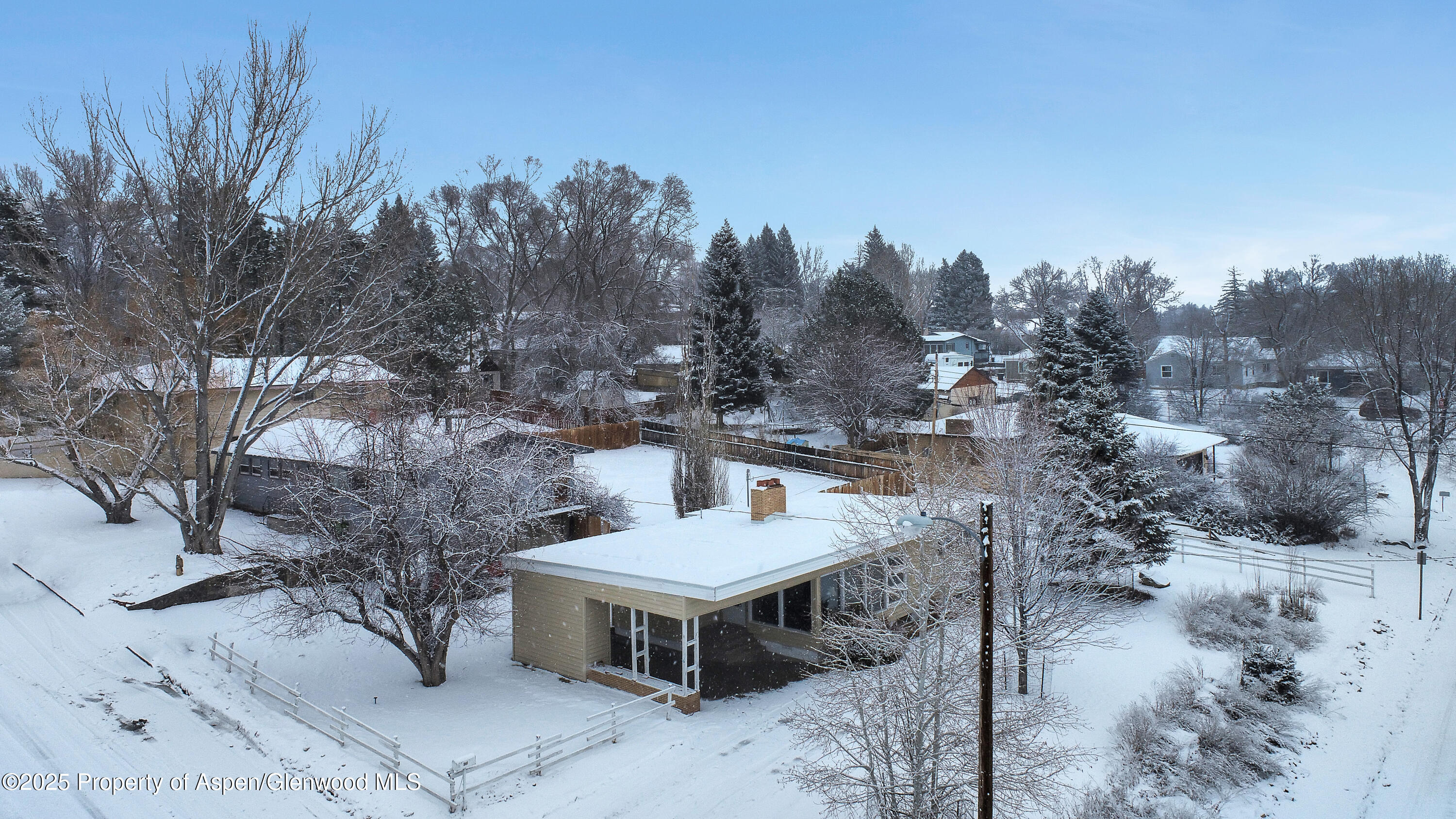 901 Pershing Street Craig, CO 81625 - Photo 34 of 37 a view of a house with a yard and sitting area