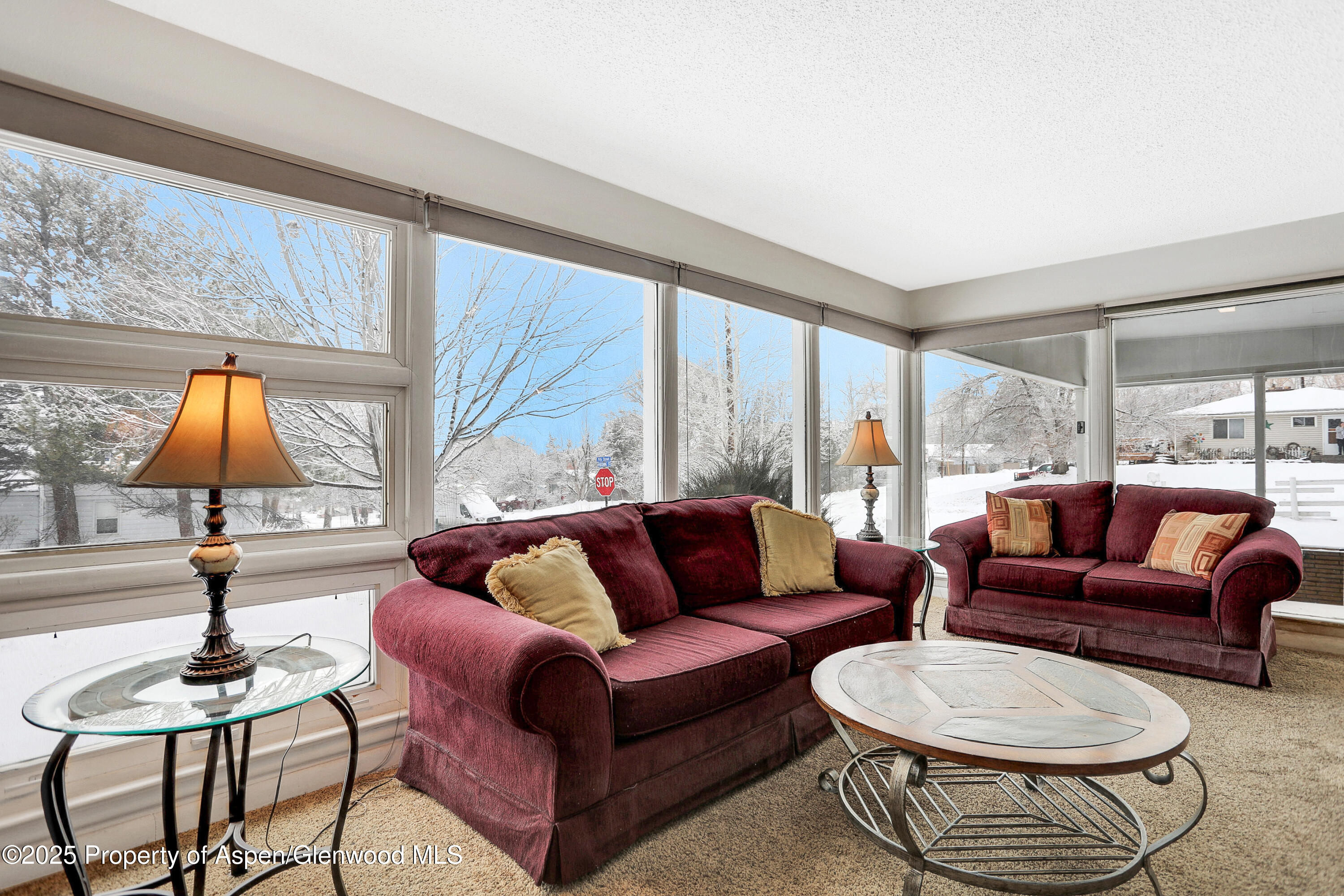 901 Pershing Street Craig, CO 81625 - Photo 4 of 37 a living room with furniture and a large window