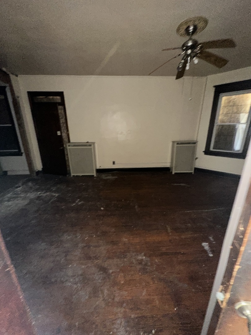7425 South Harvard Avenue Chicago, IL 60621 - Photo 2 of 31 a view of a livingroom with a fireplace