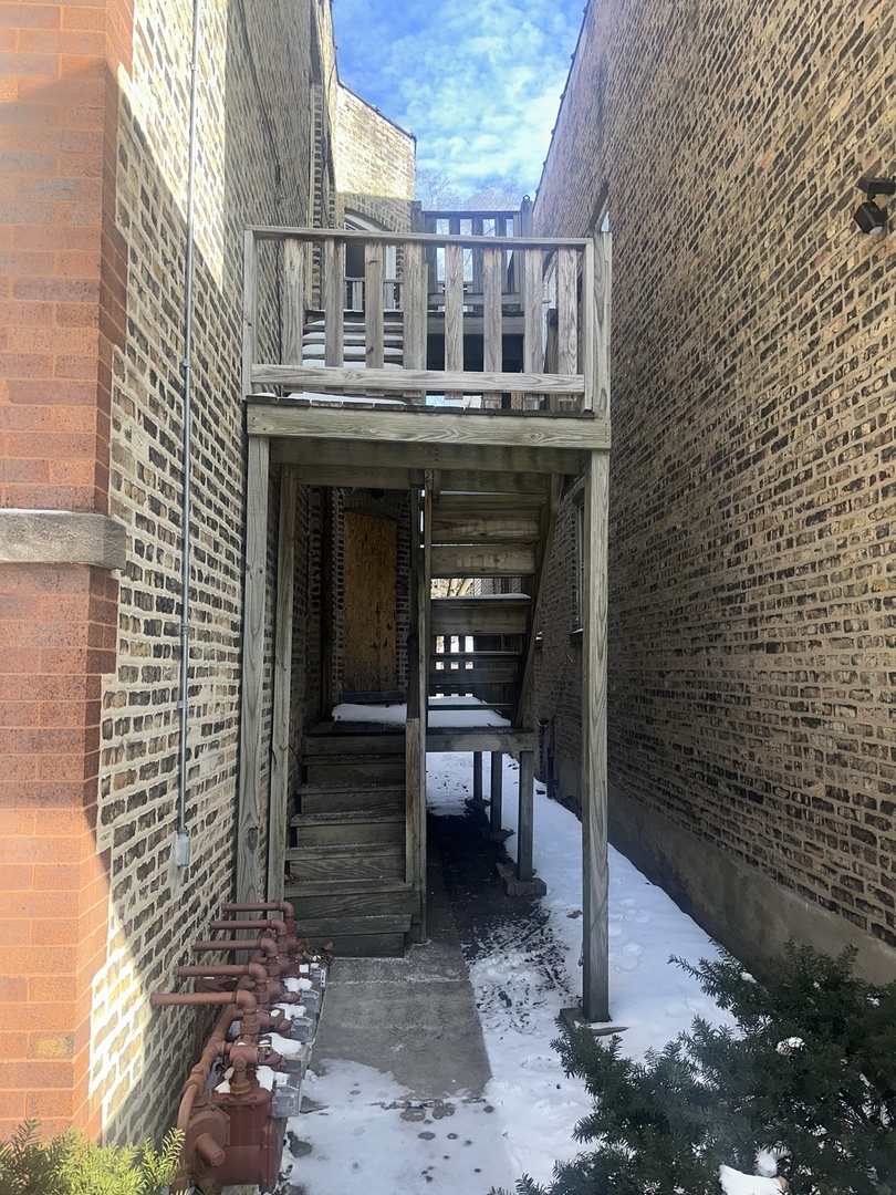 7425 South Harvard Avenue Chicago, IL 60621 - Photo 7 of 31 a view of a chairs and table in the backyard