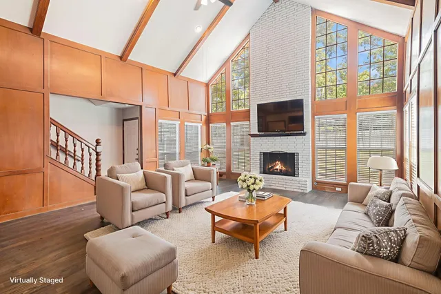 a living room with furniture fireplace and a flat screen tv
