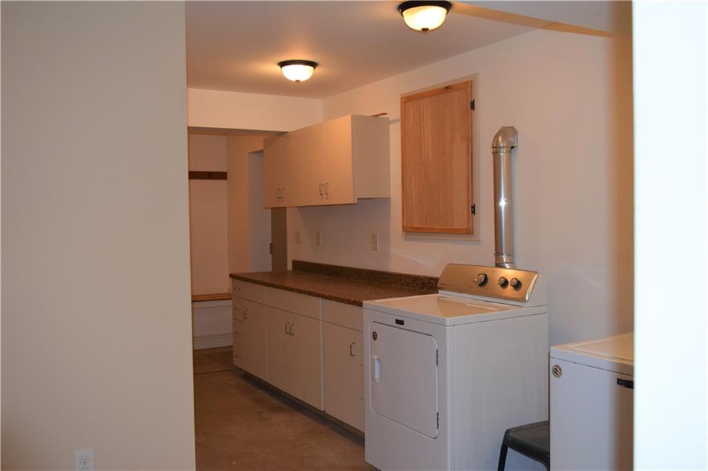 157 South Camp Run Road Fombell, PA 16123 - Photo 11 of 21 Laundry room and mud room in basement with walk out to yard.