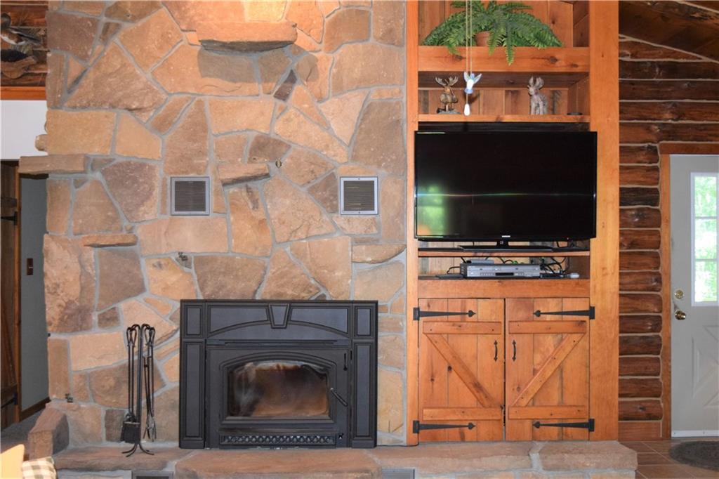 157 South Camp Run Road Fombell, PA 16123 - Photo 5 of 21 Amazing stone fire place with built in wood burner to nestle by the fire to enjoy those cold cozy nights.
