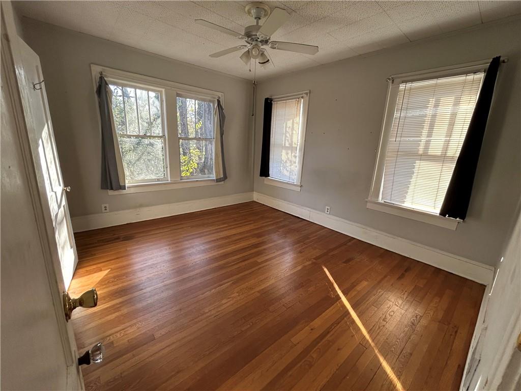 417 8th Street Northeast Atlanta, GA 30309 - Photo 11 of 16 a view of an empty room with wooden floor and a window