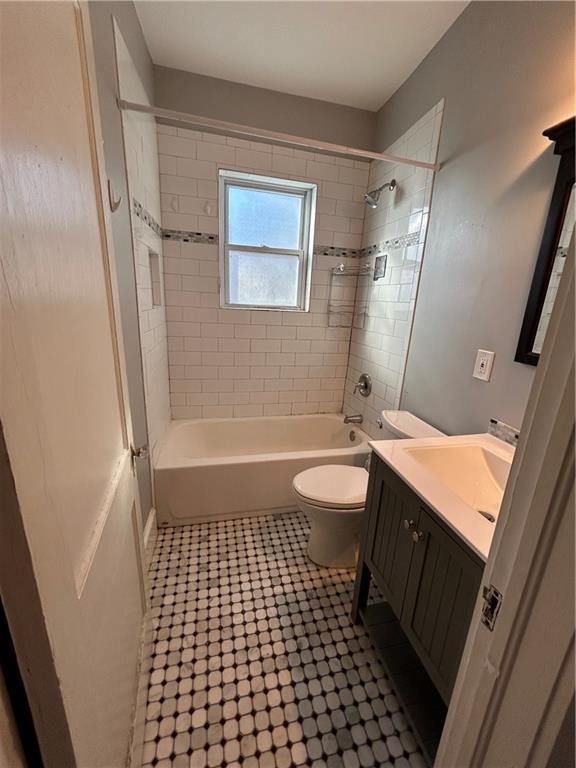 417 8th Street Northeast Atlanta, GA 30309 - Photo 13 of 16 a bathroom with a sink a toilet a mirror and shower