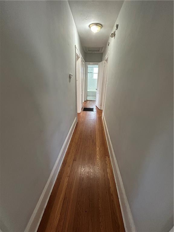 417 8th Street Northeast Atlanta, GA 30309 - Photo 14 of 16 a view of a hallway with wooden floor