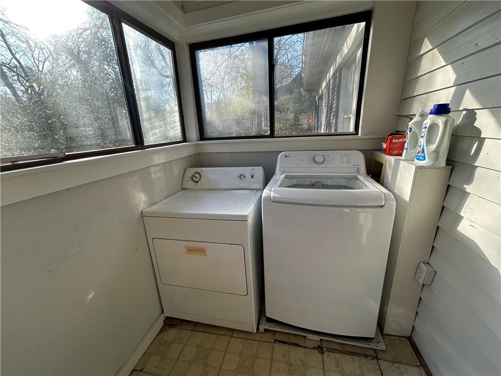 417 8th Street Northeast Atlanta, GA 30309 - Photo 15 of 16 a utility room with dryer and washer