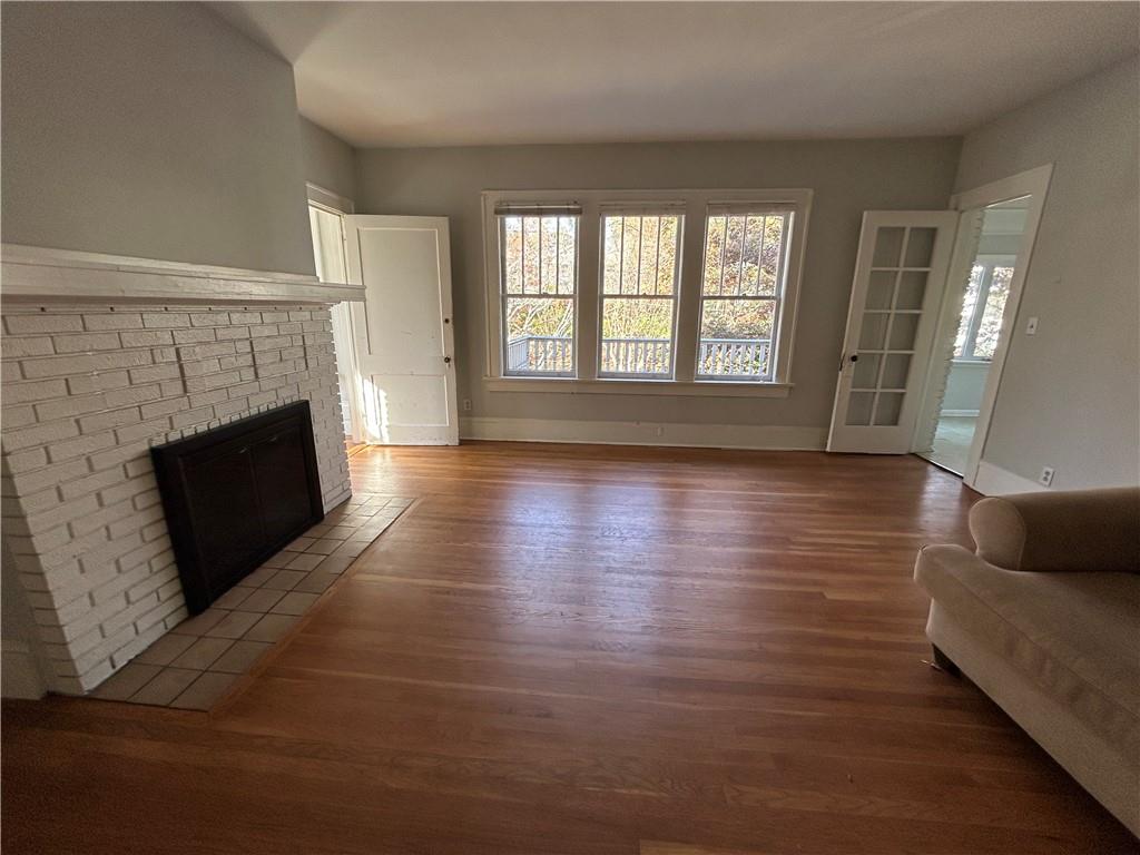 417 8th Street Northeast Atlanta, GA 30309 - Photo 4 of 16 a living room with furniture and a fireplace