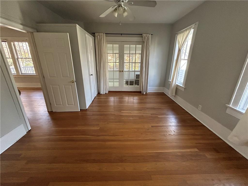 417 8th Street Northeast Atlanta, GA 30309 - Photo 10 of 16 a view of an empty room with wooden floor and a window