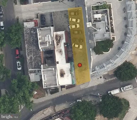 an aerial view of residential house with outdoor space and parking