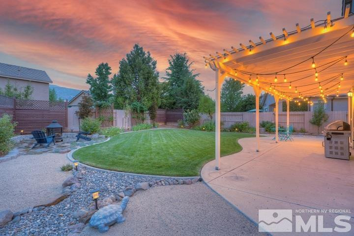 10520 Baton Court Reno, NV 89521 - Photo 12 of 38 front view of a house with a yard and potted plants