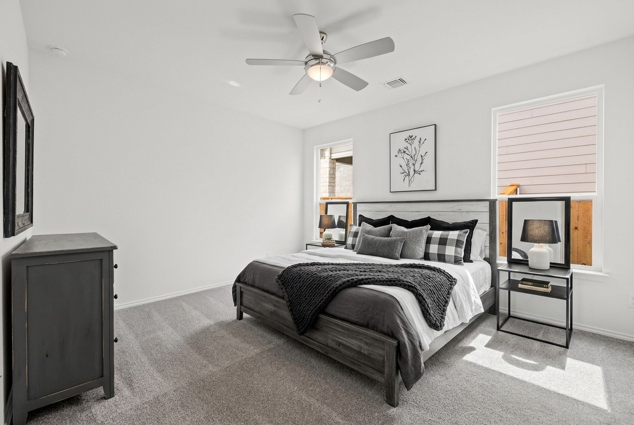 260 Feathers Street Jarrell, TX 76537 - Photo 15 of 34 a bed room with a bed and a ceiling fan