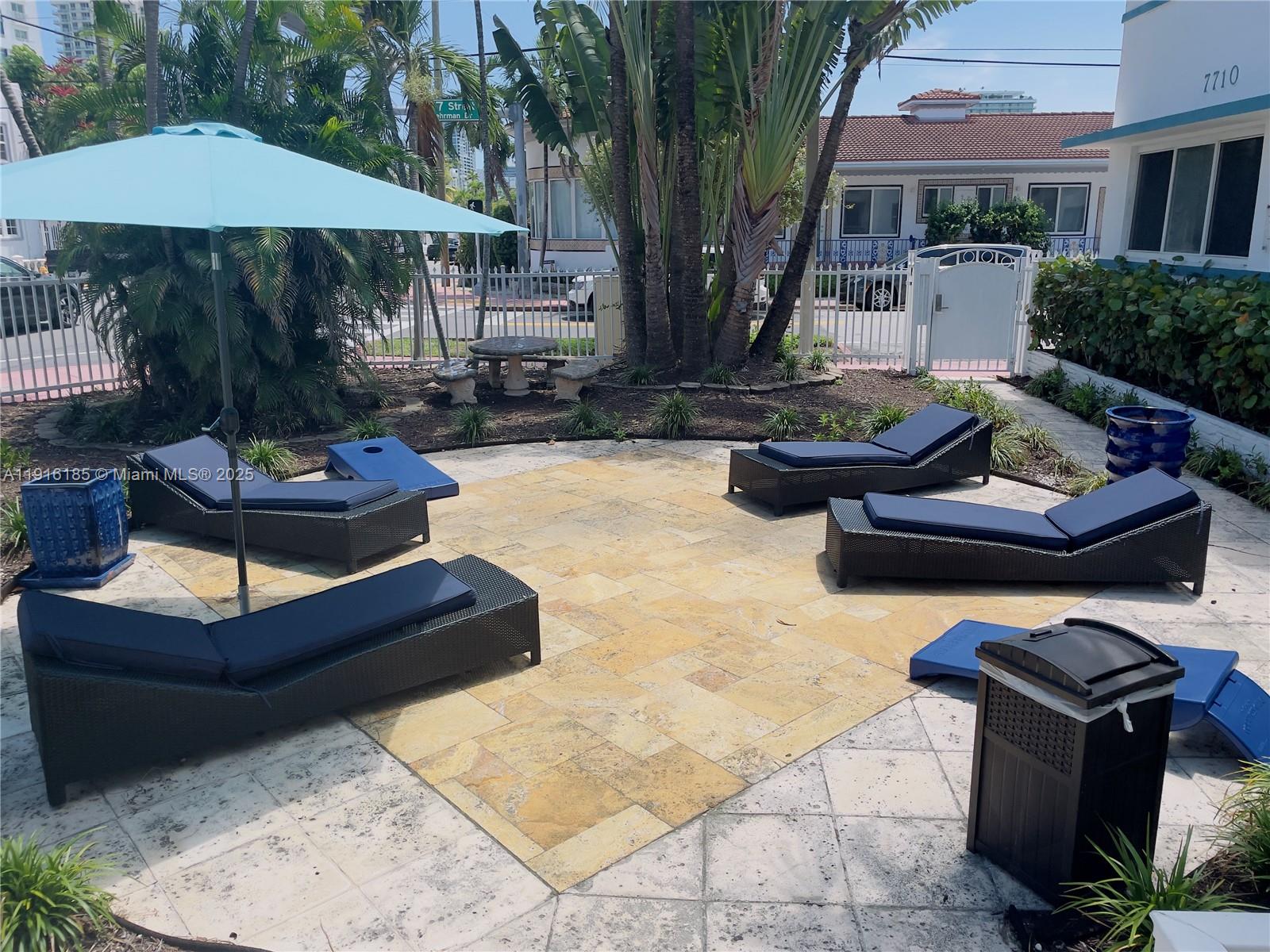 7710 Harding Avenue, Unit 403 Miami Beach, FL 33141 - Photo 2 of 7 a front view of a house with patio