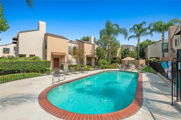 a view of a swimming pool with a patio