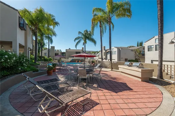 a view of a backyard with sitting area
