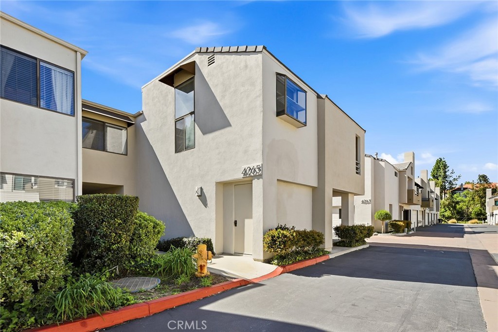 4265 Las Virgenes Road, Unit 2 Calabasas, CA 91302 - Photo 3 of 26 a view of a white apartments with large windows