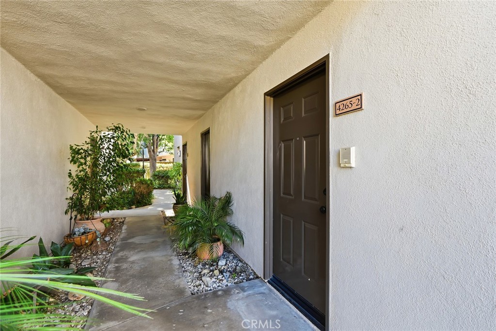 4265 Las Virgenes Road, Unit 2 Calabasas, CA 91302 - Photo 4 of 26 a couple of potted plants in front of door