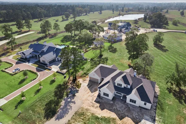 an aerial view of houses with yard