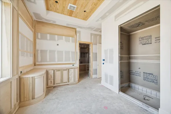 a hallway with cabinets