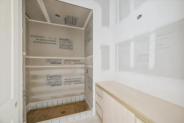 a view of cabinets and wooden floor