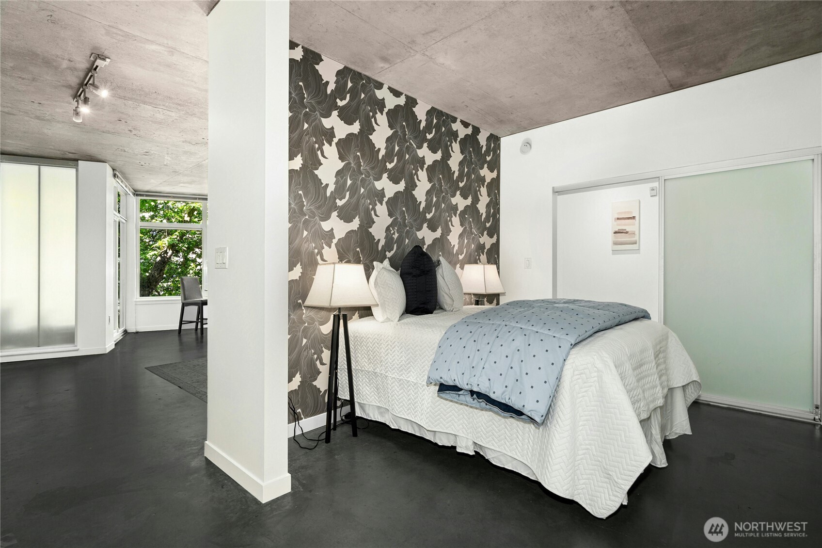 501 Roy Street, Unit F239 Seattle, WA 98109 - Photo 16 of 27 a bedroom with a bed and a window