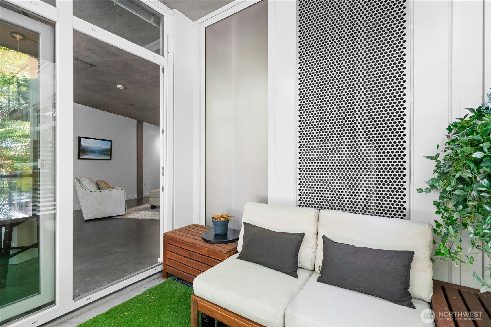 501 Roy Street, Unit F239 Seattle, WA 98109 - Photo 21 of 27 a outdoor living space with furniture and a potted plant