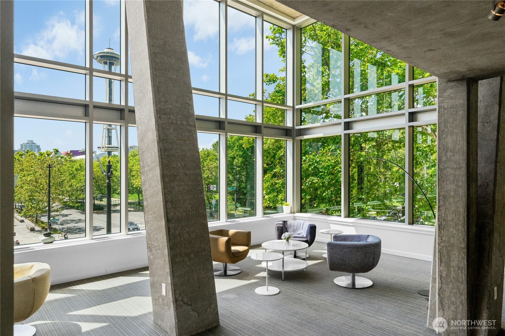 501 Roy Street, Unit F239 Seattle, WA 98109 - Photo 24 of 27 a living room with furniture and a window