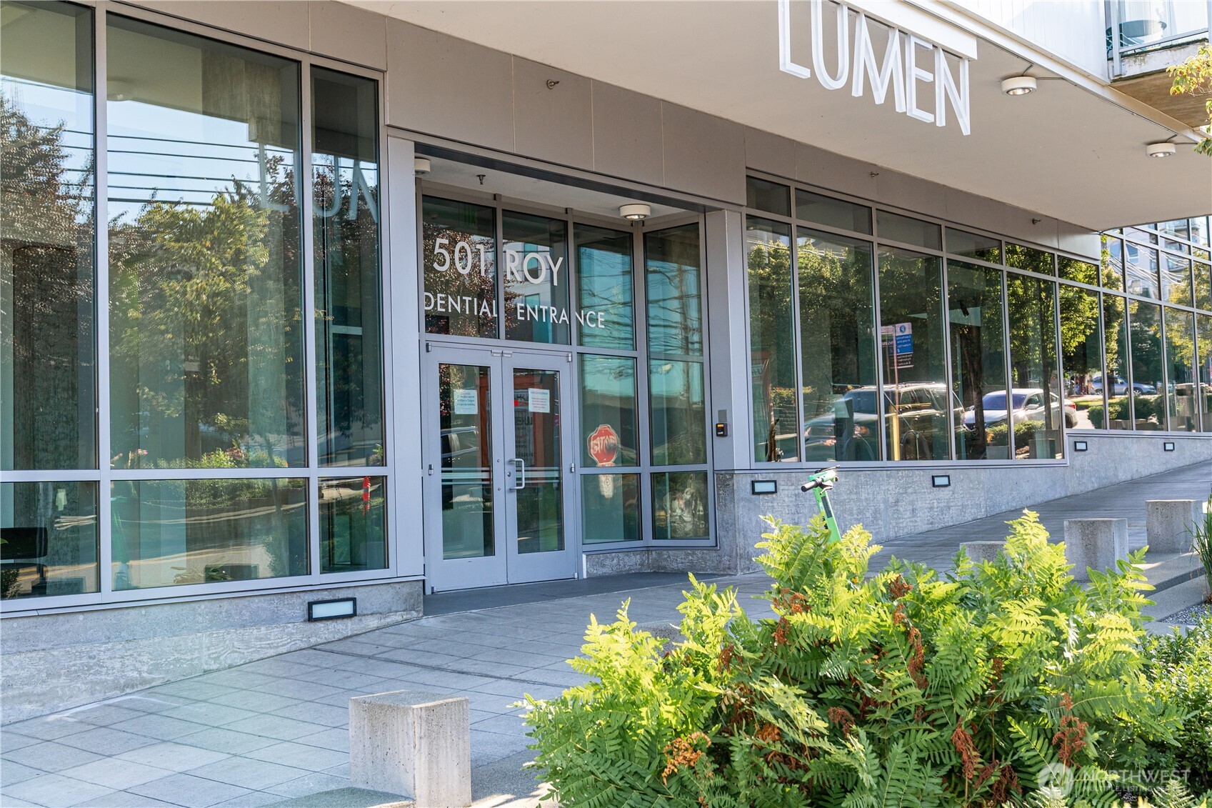 501 Roy Street, Unit F239 Seattle, WA 98109 - Photo 3 of 27 a view of a house with a large window and a yard