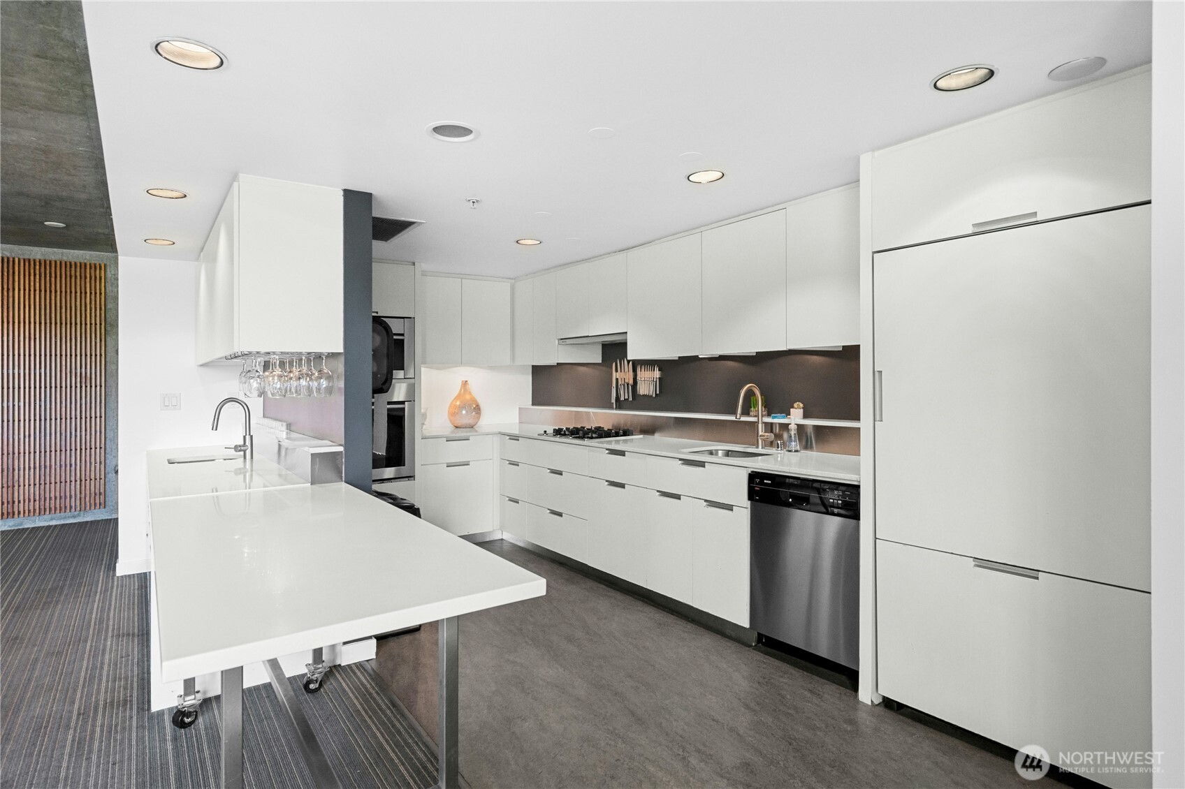 501 Roy Street, Unit F239 Seattle, WA 98109 - Photo 10 of 27 a kitchen with kitchen island a sink stove and refrigerator
